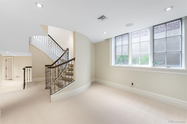 465 Monroe St, Denver, CO 80206 - stairway with carpet flooring, recessed lighting, and baseboards