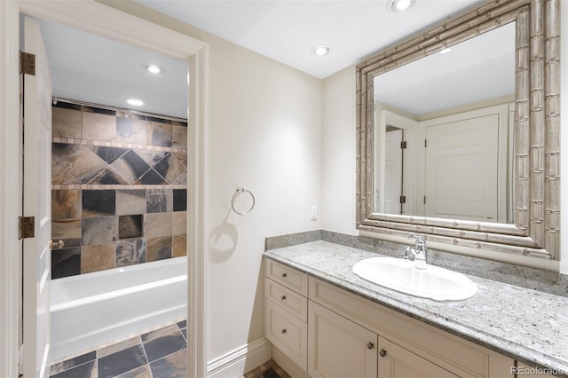 465 Monroe St, Denver, CO 80206 - full bath featuring vanity, recessed lighting, washtub / shower combination, and baseboards