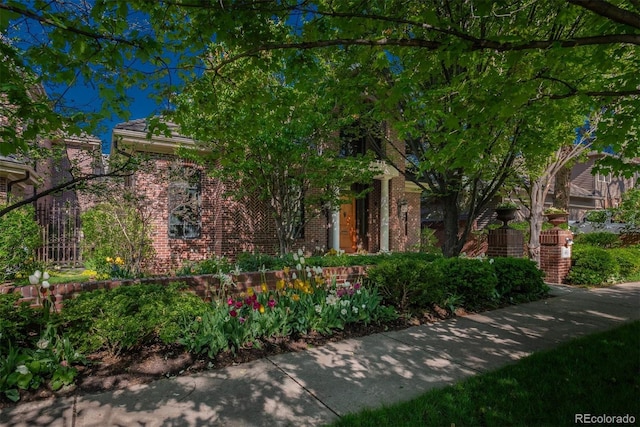 465 Monroe St, Denver, CO 80206 - view of property hidden behind natural elements featuring brick siding