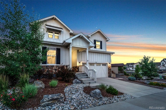 4082 Fortune Ln, Castle Rock, CO 80109 - craftsman-style home featuring board and batten siding, an attached garage, concrete driveway, and stone siding