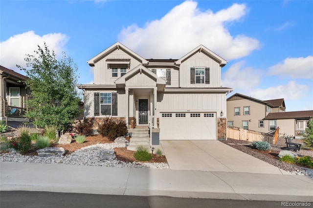 4082 Fortune Ln, Castle Rock, CO 80109 - craftsman-style home featuring driveway, a garage, stone siding, and board and batten siding