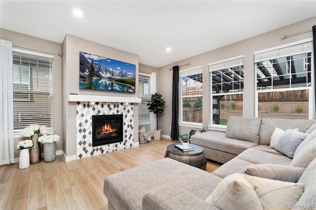 4082 Fortune Ln, Castle Rock, CO 80109 - living room with wood finished floors, a fireplace, and recessed lighting
