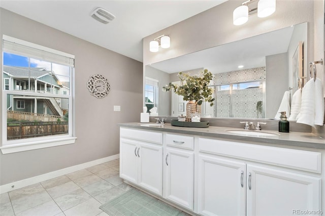 4082 Fortune Ln, Castle Rock, CO 80109 - full bath featuring double vanity, healthy amount of natural light, a shower stall, and tile patterned flooring