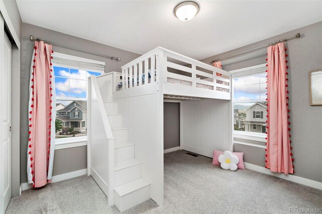 4082 Fortune Ln, Castle Rock, CO 80109 - unfurnished bedroom with carpet floors, multiple windows, and a closet