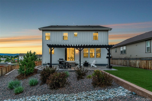 4082 Fortune Ln, Castle Rock, CO 80109 - rear view of property with a pergola, board and batten siding, a fenced backyard, and a patio