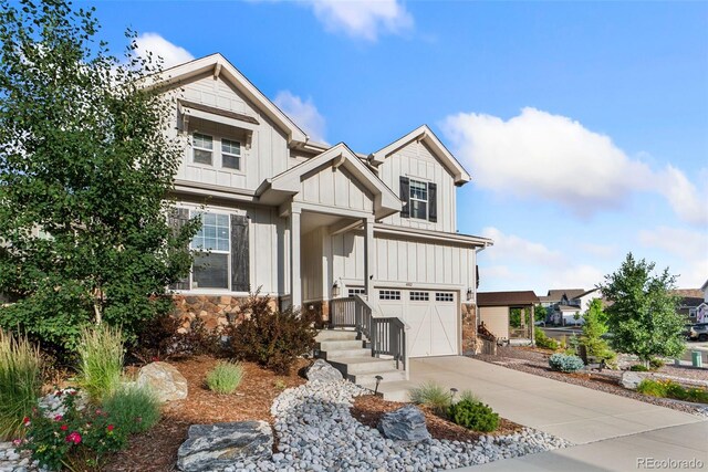 4082 Fortune Ln, Castle Rock, CO 80109 - craftsman-style home with board and batten siding, an attached garage, driveway, and stone siding