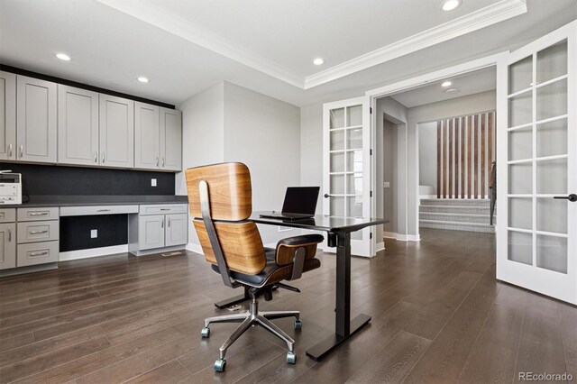 office area featuring crown molding, dark wood-style flooring, built in study area, and french doors