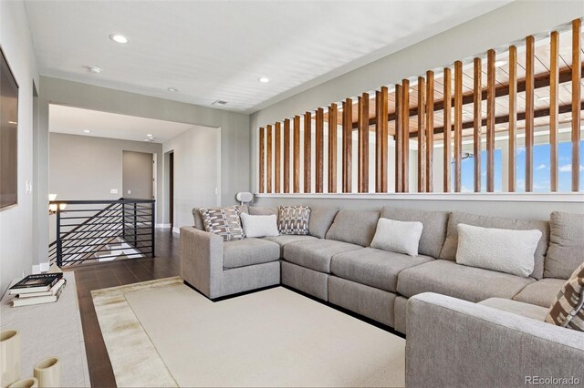 living room with recessed lighting and wood finished floors
