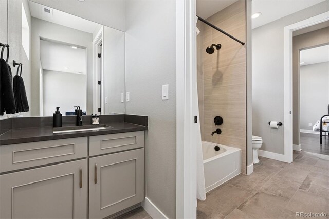 bathroom with vanity, baseboards, toilet, shower / bathtub combination, and recessed lighting