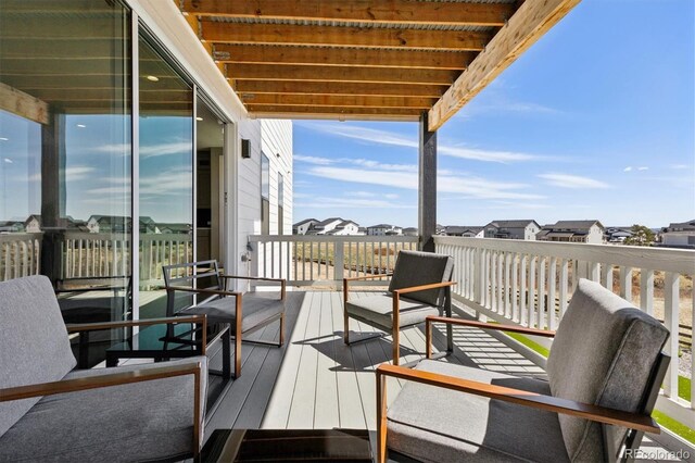 view of wooden balcony with a residential view and a wooden deck