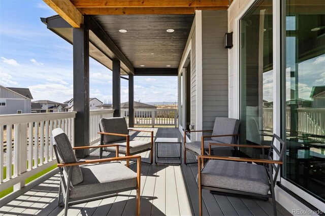 wooden terrace featuring outdoor lounge area