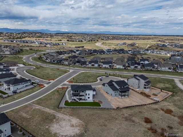 drone / aerial view with a residential view and a mountain view