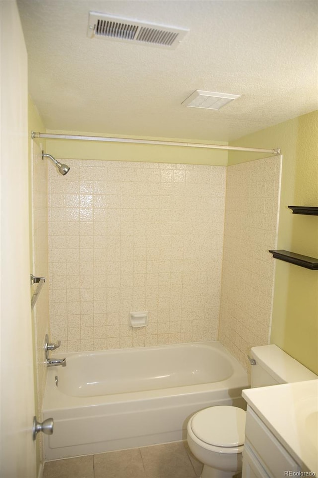 bathroom featuring tile patterned floors,  shower combination, toilet, a textured ceiling, and vanity