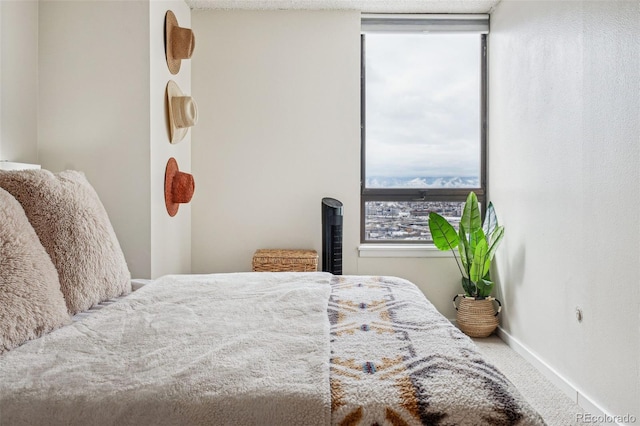 bedroom with carpet flooring and baseboards