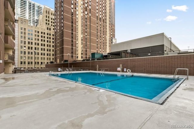 view of pool with fence