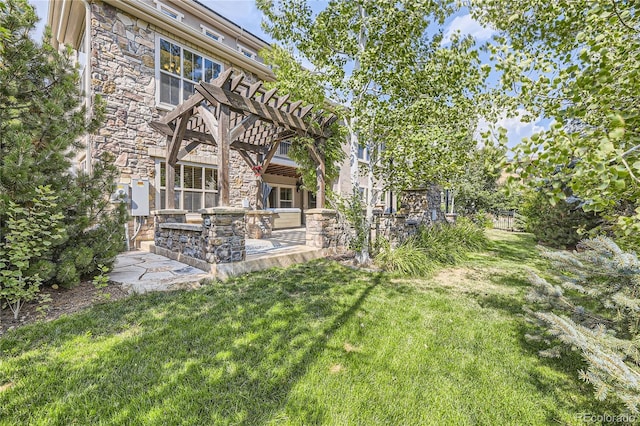 view of yard featuring area for grilling, a pergola, and a patio