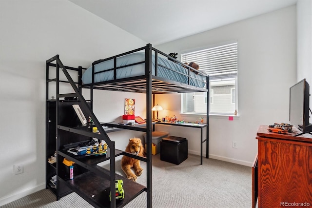 bedroom with carpet flooring and baseboards