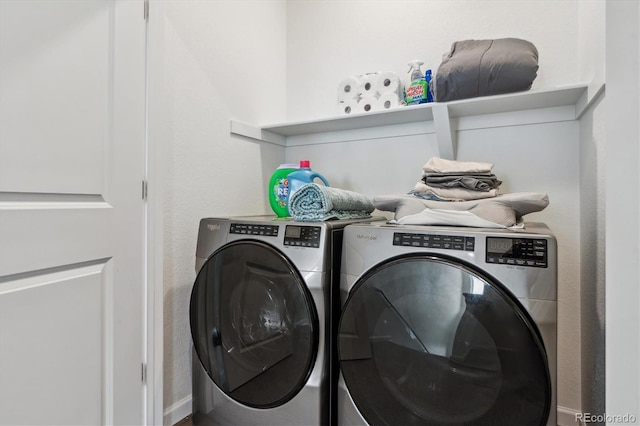 clothes washing area featuring laundry area and independent washer and dryer