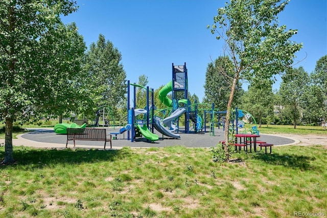 community jungle gym with a yard