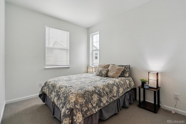 bedroom featuring carpet floors and baseboards