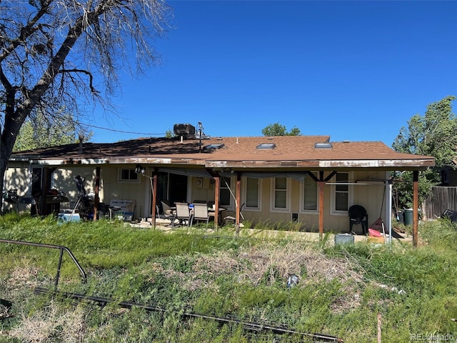 841 S 6th Ave, Brighton, CO 80601 - rear view of property with a patio area