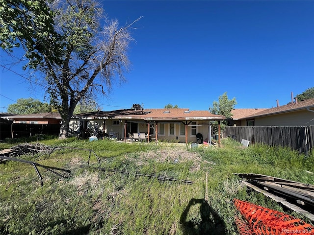 841 S 6th Ave, Brighton, CO 80601 - rear view of house with a patio