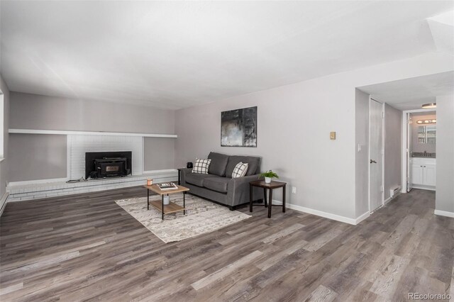 living room featuring a fireplace and hardwood / wood-style flooring