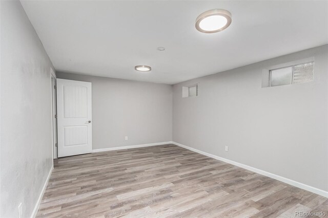 basement featuring hardwood / wood-style floors