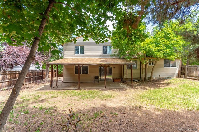 back of property with a patio