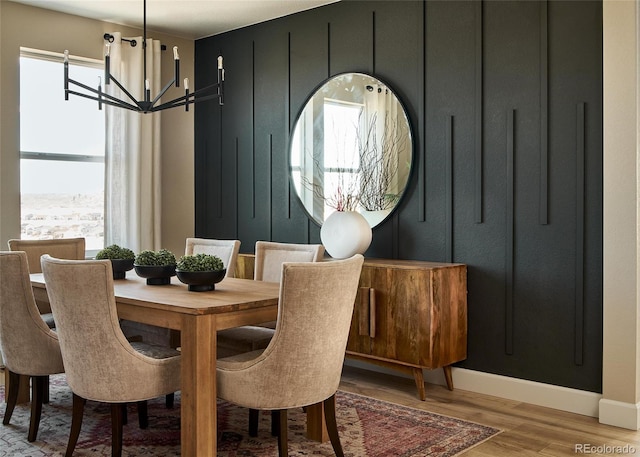 dining space featuring a chandelier and light hardwood / wood-style floors