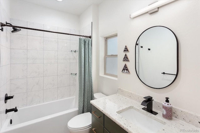 full bathroom featuring vanity, shower / tub combo, and toilet