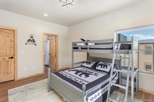 bedroom with hardwood / wood-style floors