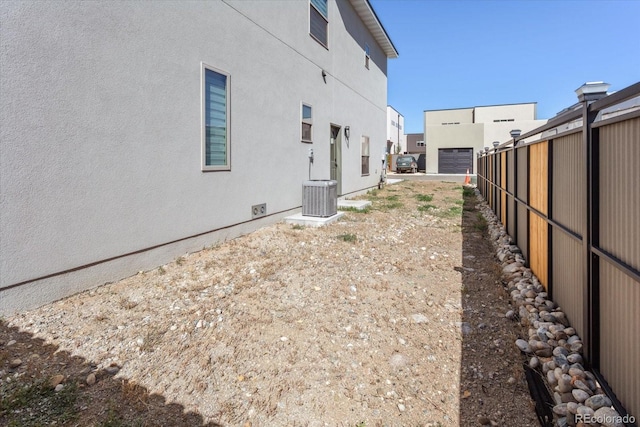 view of yard featuring central air condition unit