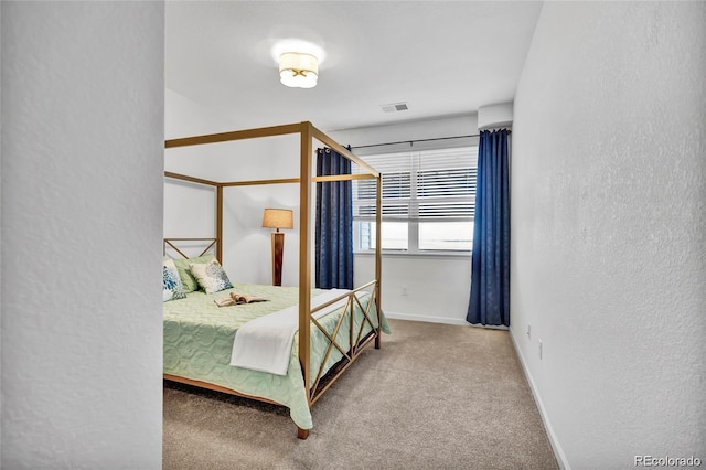 4569 Copeland Loop Unit 203, Highlands Ranch, CO 80126 - bedroom featuring carpet flooring and a textured wall