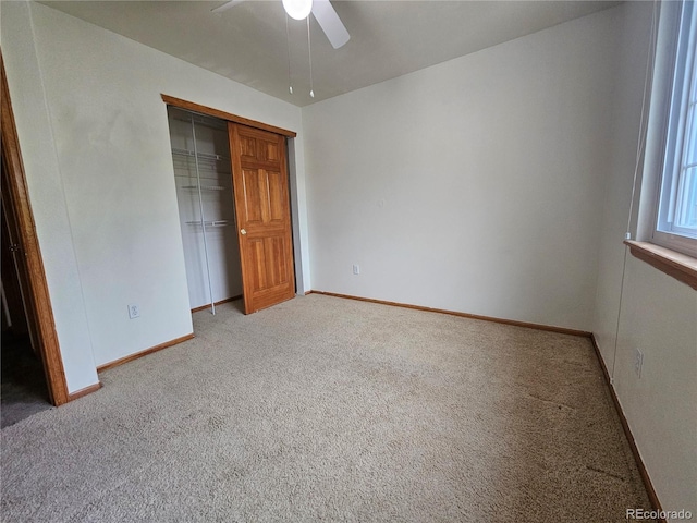 5571 S Sicily St, Aurora, CO 80015 - unfurnished bedroom with light colored carpet, a closet, and a ceiling fan