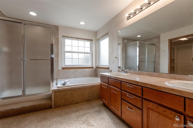 5571 S Sicily St, Aurora, CO 80015 - full bathroom with a stall shower, double vanity, a garden tub, and recessed lighting