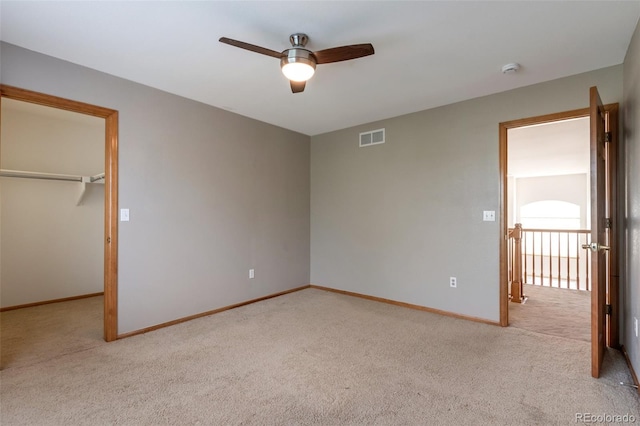 5571 S Sicily St, Aurora, CO 80015 - unfurnished bedroom with carpet, a spacious closet, a ceiling fan, and a closet