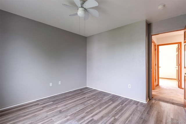 5571 S Sicily St, Aurora, CO 80015 - empty room featuring a ceiling fan, wood finished floors, and a smoke detector