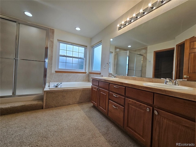 5571 S Sicily St, Aurora, CO 80015 - bathroom featuring a stall shower, double vanity, a bath, carpet, and recessed lighting