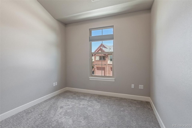 unfurnished room featuring carpet