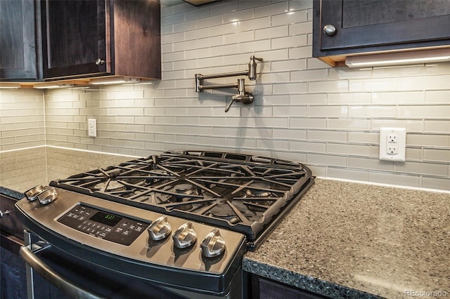 kitchen featuring decorative backsplash and stainless steel gas stove