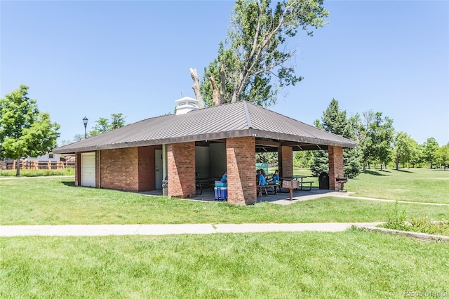 surrounding community with a gazebo, a yard, and a patio