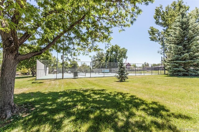 view of yard with tennis court