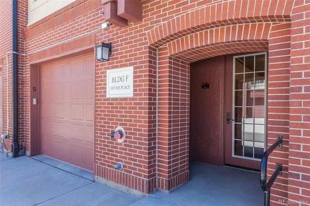 doorway to property featuring a garage