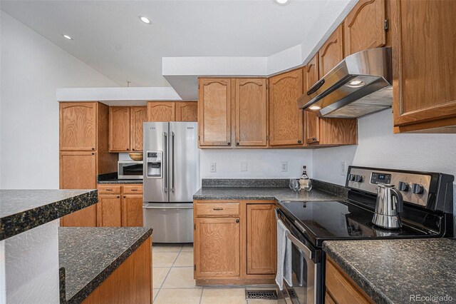 kitchen with stainless steel appliances, under cabinet range hood, light tile patterned floors, brown cabinets, and recessed lighting