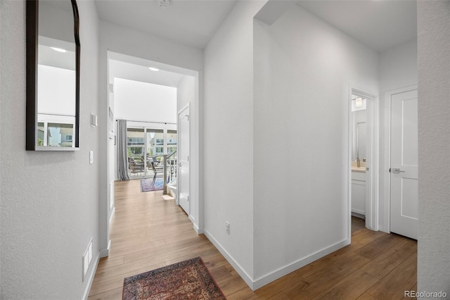 9016 Moondance Dr, Littleton, CO 80125 - corridor with wood finished floors and baseboards