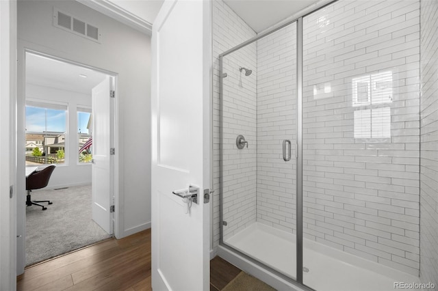 9016 Moondance Dr, Littleton, CO 80125 - full bathroom with wood finished floors and a stall shower