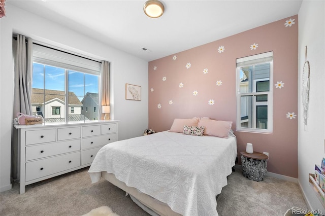 9016 Moondance Dr, Littleton, CO 80125 - bedroom with light colored carpet, an accent wall, and wallpapered walls