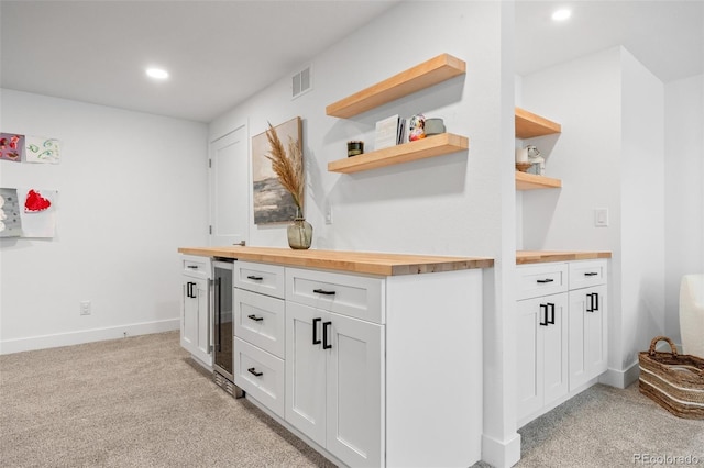 9016 Moondance Dr, Littleton, CO 80125 - bar with light carpet, recessed lighting, and wine cooler