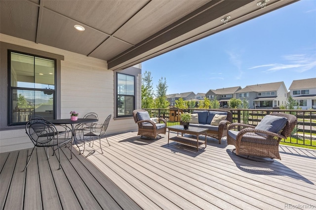 9016 Moondance Dr, Littleton, CO 80125 - wooden deck with outdoor lounge area, a residential view, and outdoor dining space